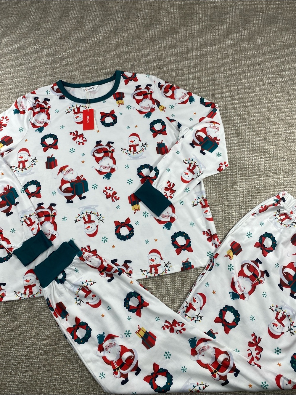Womans light weight pajamas in Santa, presents, wreaths print Christmas holidays